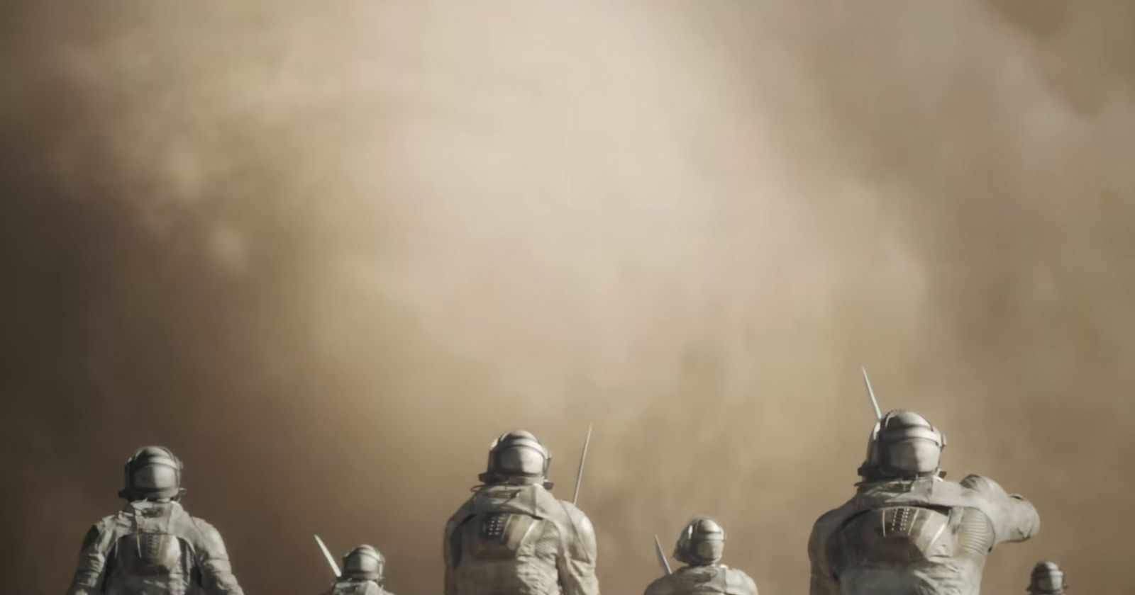 a group of people standing in front of a dust storm