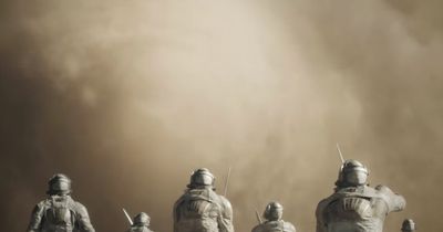 a group of people standing in front of a dust storm