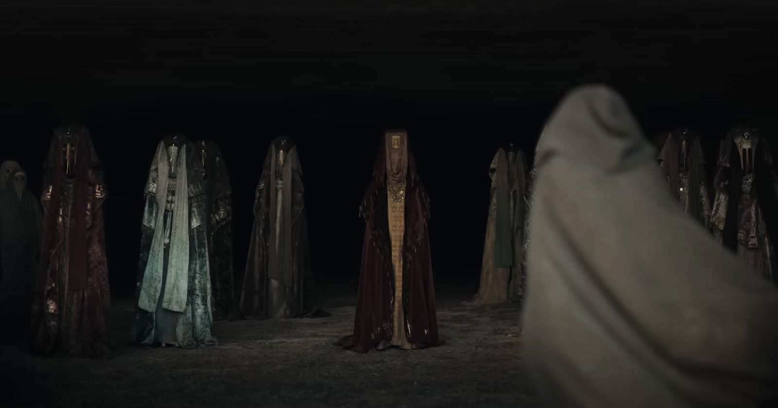 a group of people standing in a dark room