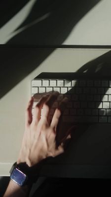 a person is typing on a computer keyboard