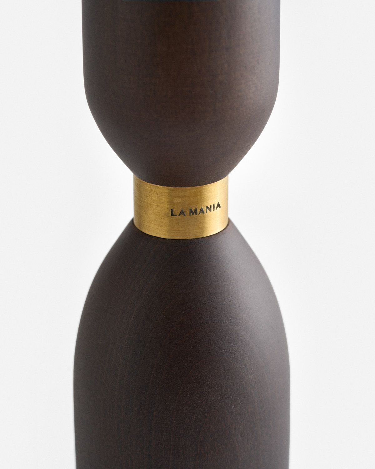 a brown vase with a gold band around it