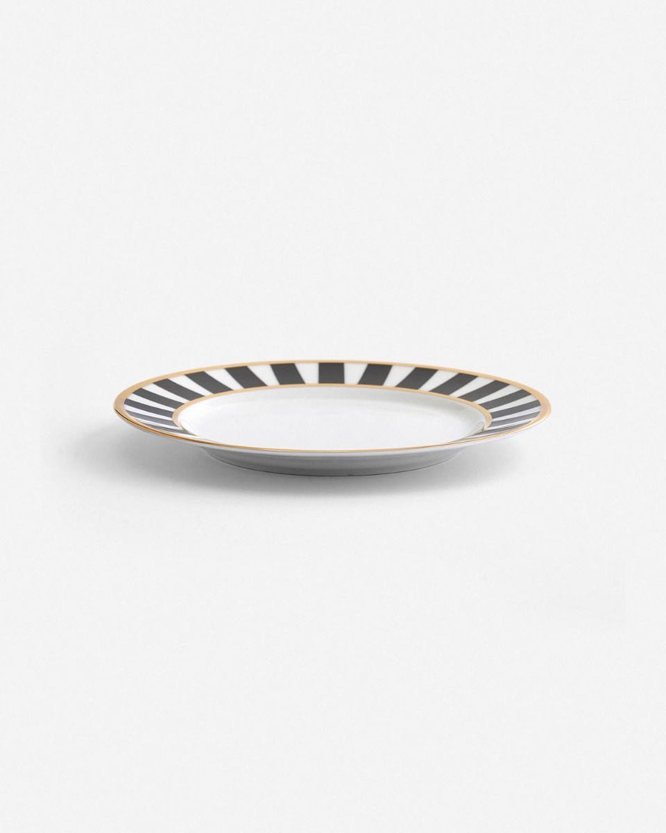 a black and white striped plate on a white background