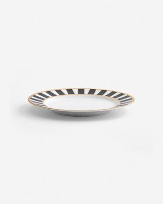 a black and white striped plate on a white background