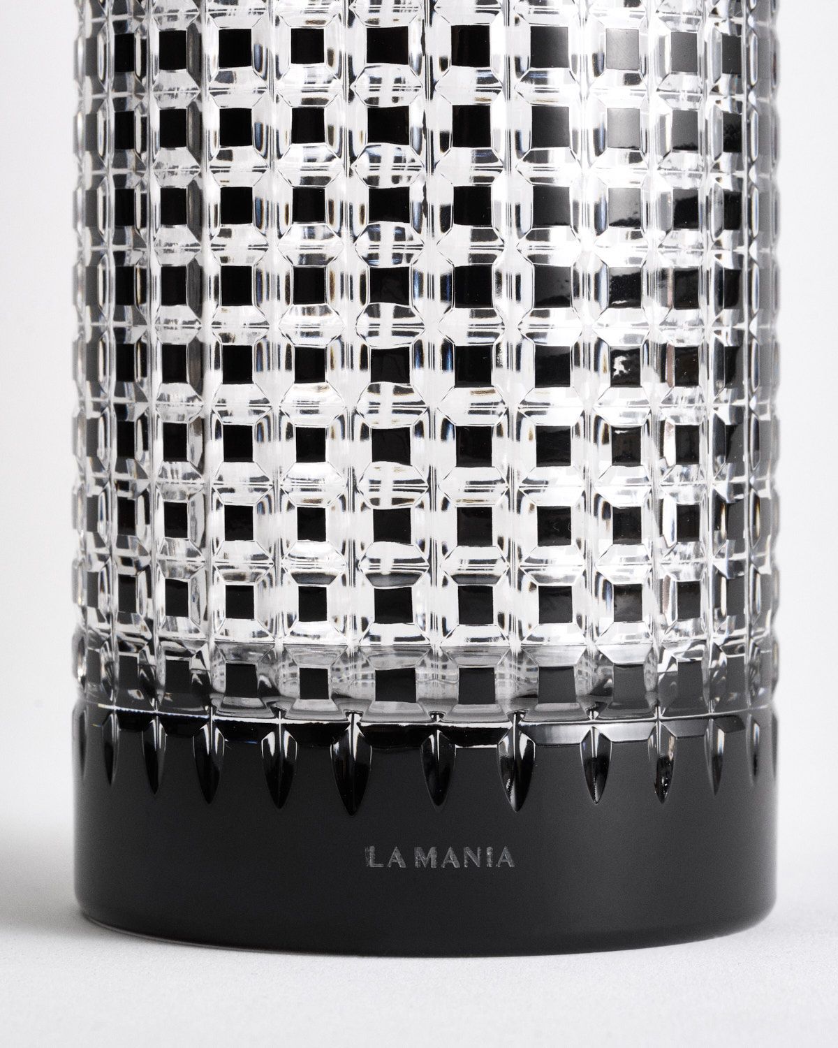 a black and white vase sitting on top of a table