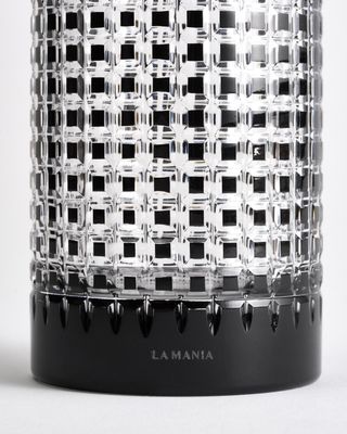 a black and white vase sitting on top of a table