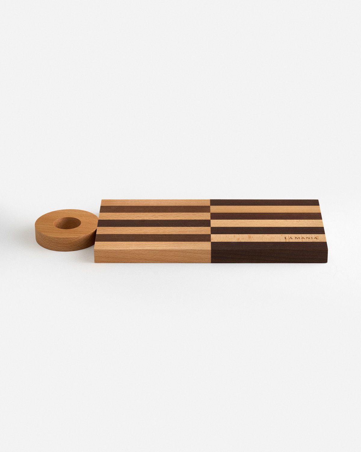 a wooden cutting board with a roll of tape next to it
