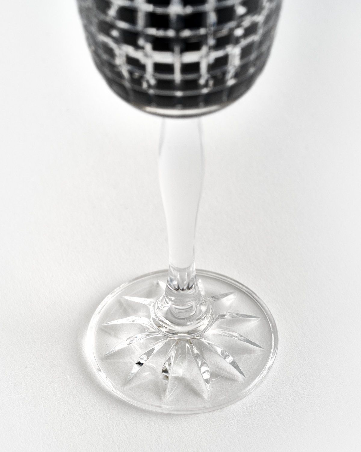 a wine glass sitting on top of a table