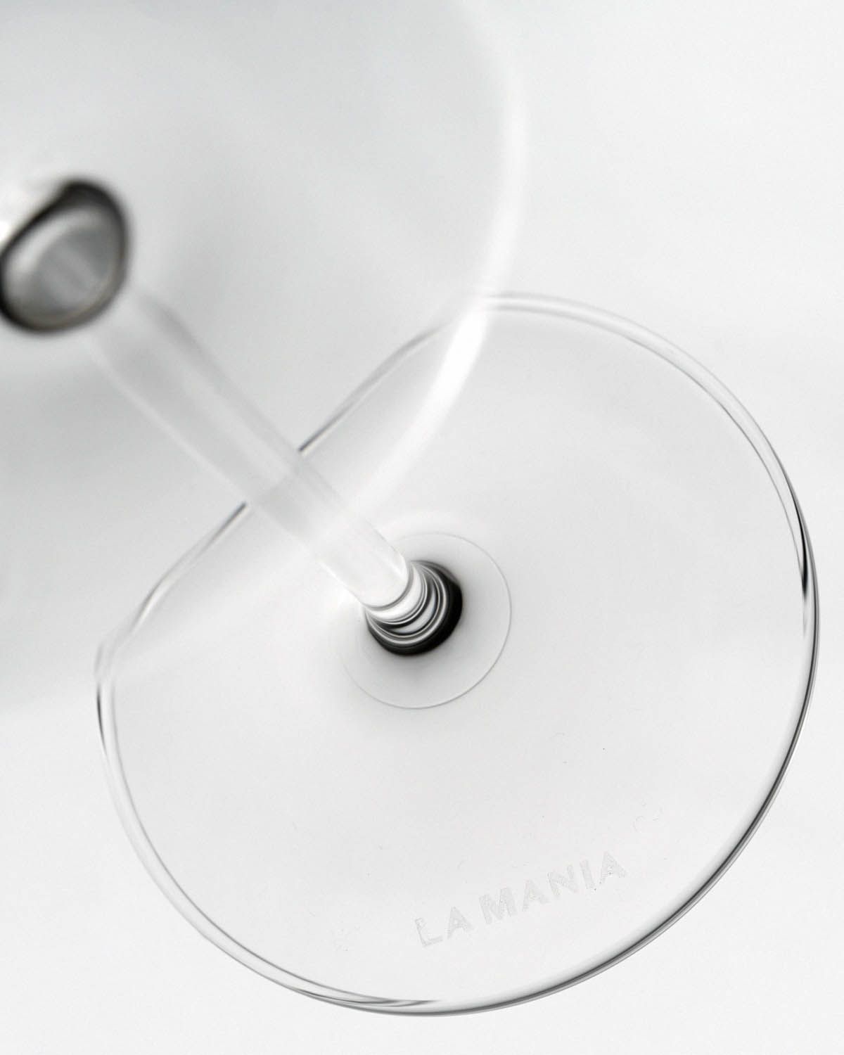 a close up of a wine glass on a table