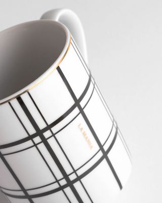 a close up of a coffee cup on a table