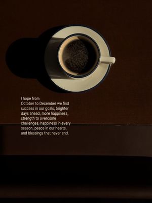 a cup of coffee sitting on top of a table