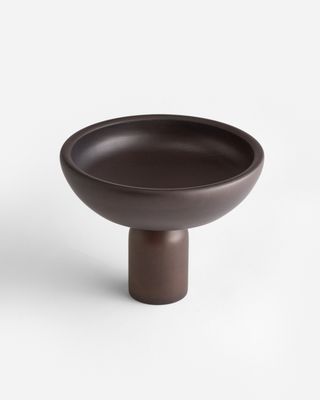 a brown bowl sitting on top of a table