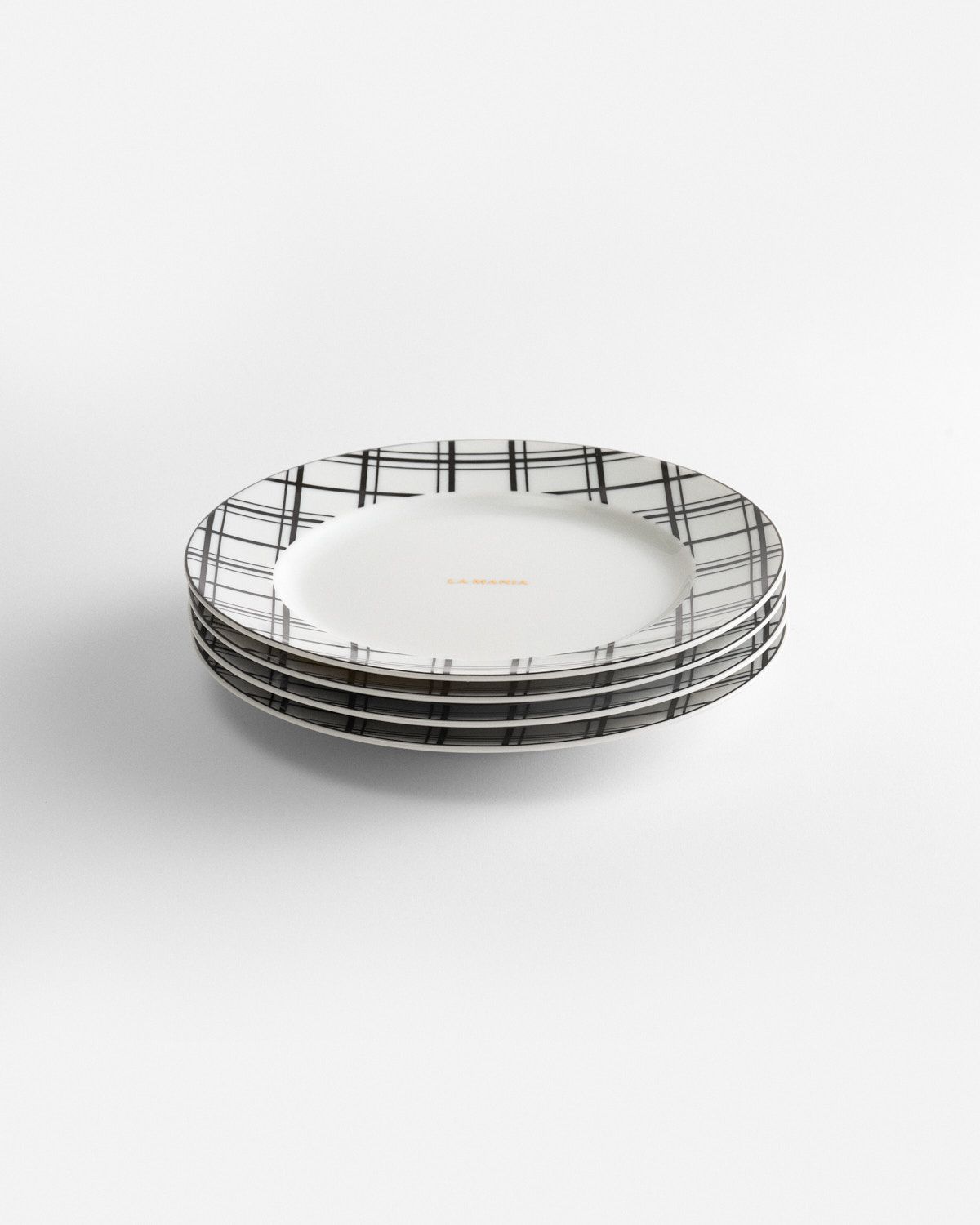 a stack of plates sitting on top of a white table