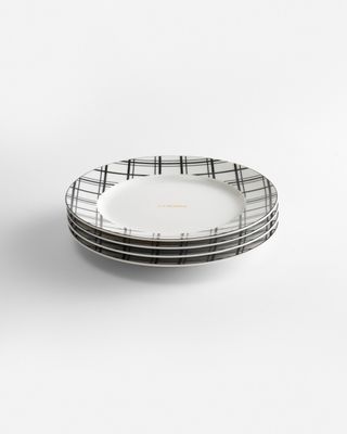 a stack of plates sitting on top of a white table