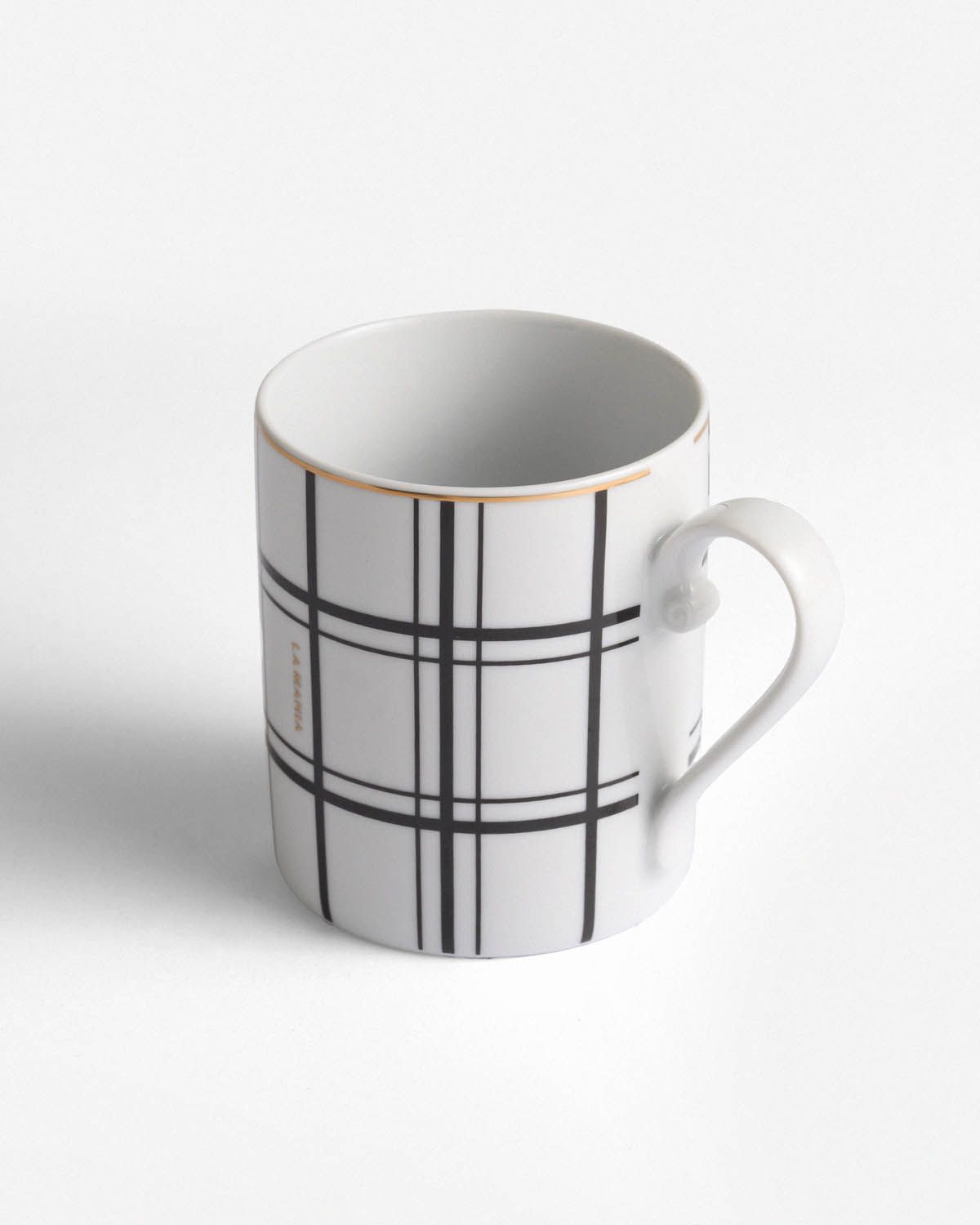 a white coffee cup with a black and white plaid pattern