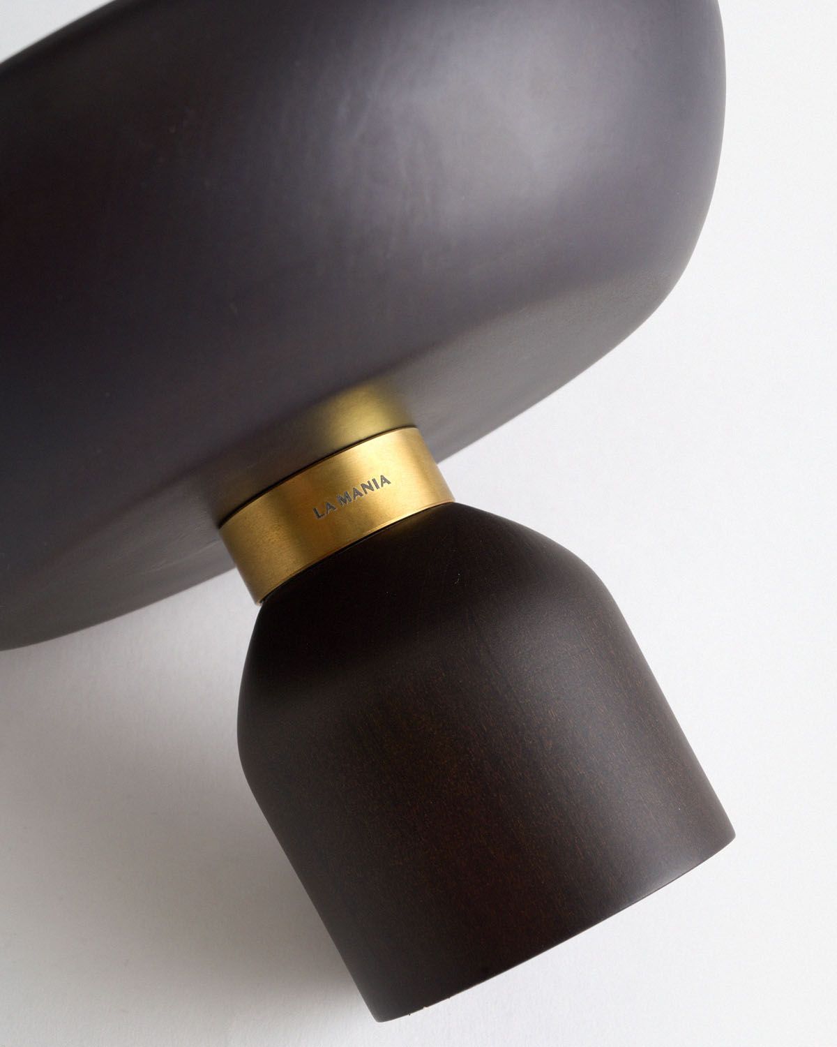 a close up of a lamp on a white surface