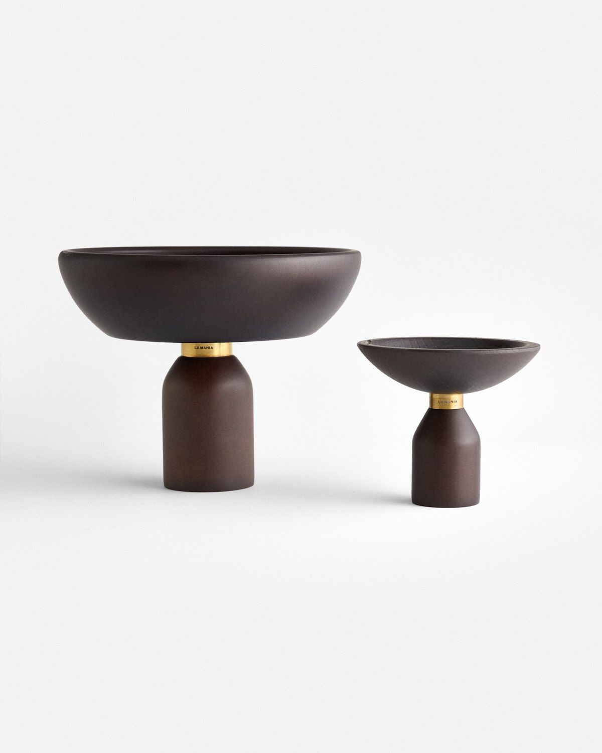 a couple of brown bowls sitting on top of each other