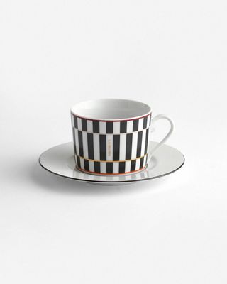 a black and white checkered cup and saucer