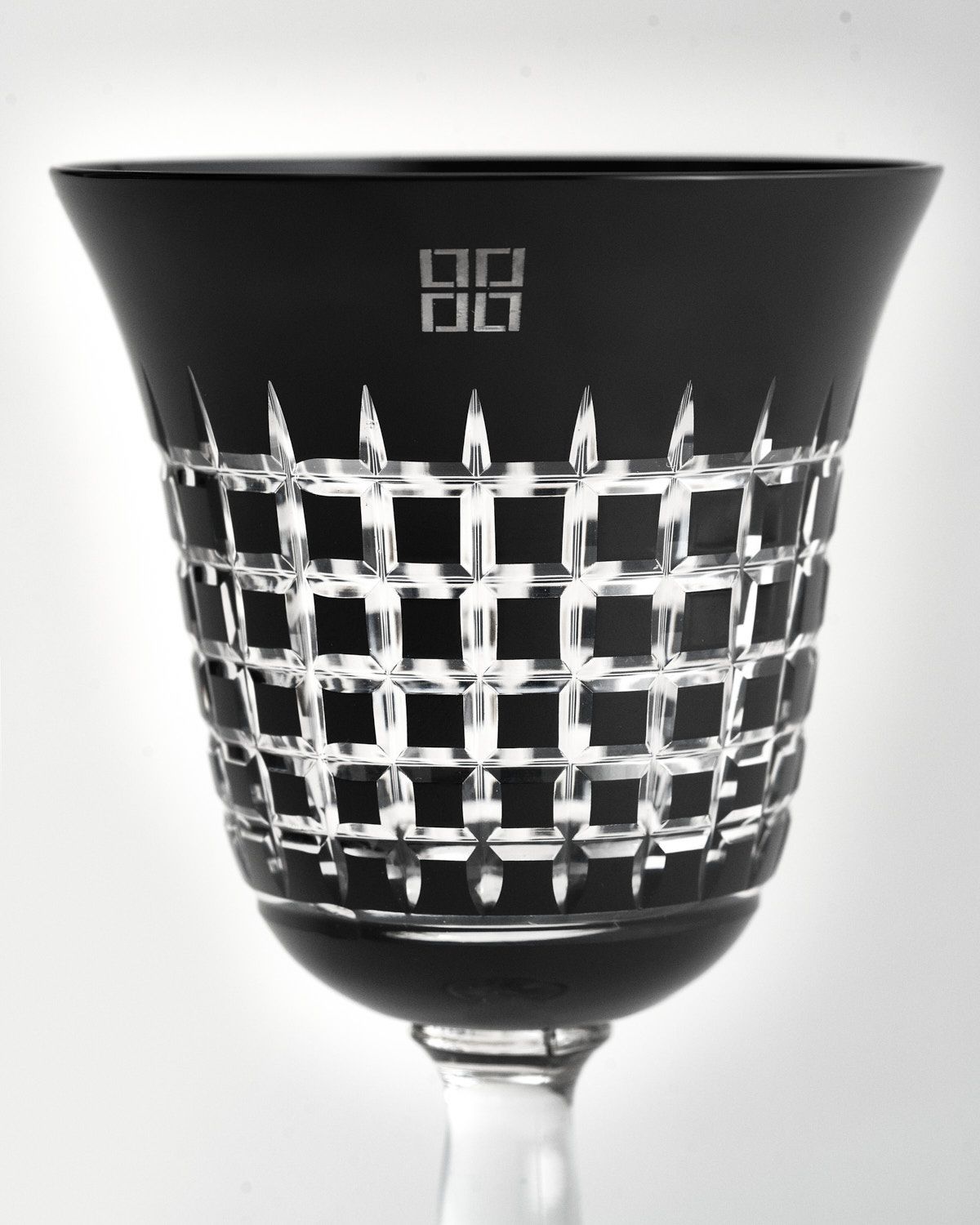 a black and white photo of a glass bowl