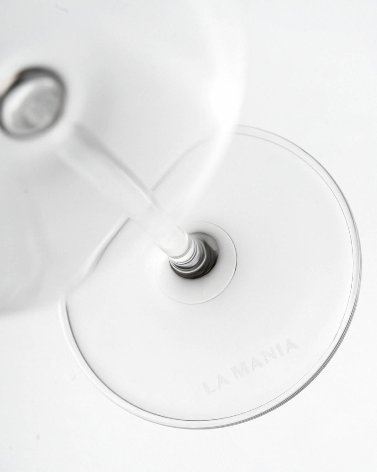 a close up of a wine glass on a table