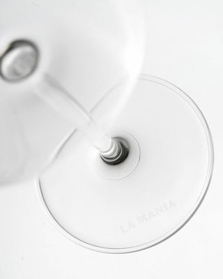 a close up of a wine glass on a table