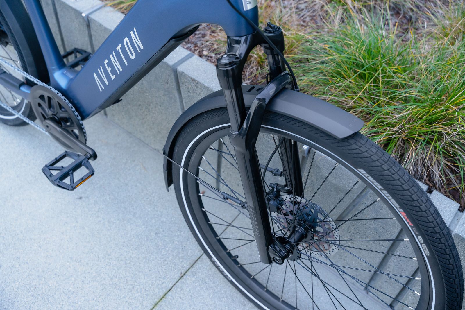 a close up of a bike parked on a sidewalk