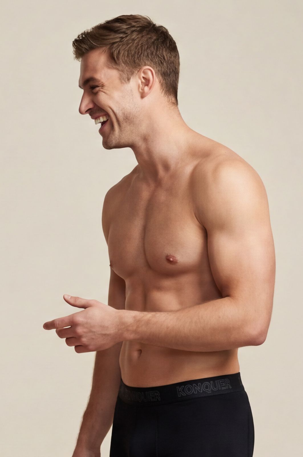 a shirtless man in a black boxer briefs