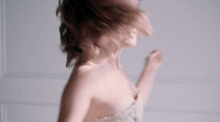 a blurry photo of a woman in a dress