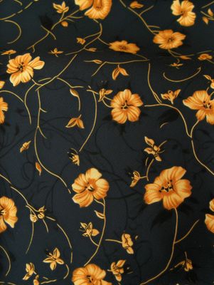 a black background with yellow flowers on it