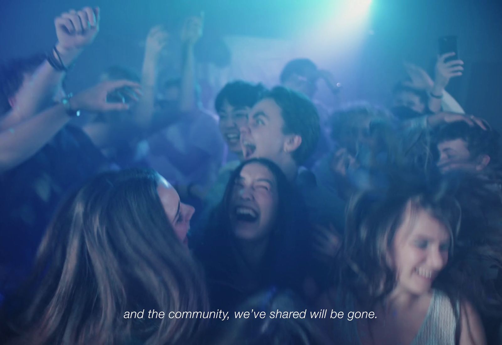 a group of people standing in front of a crowd