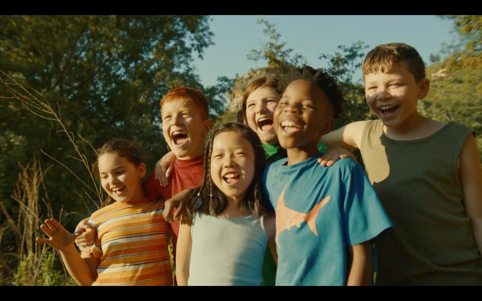 a group of young children standing next to each other