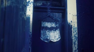 a pair of shorts hanging on a clothes rack