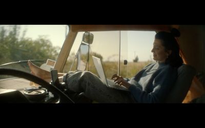 a woman sitting in the drivers seat of a truck