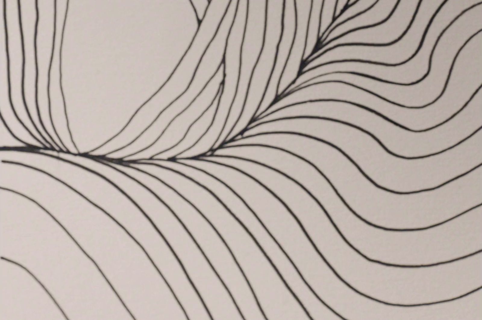 a black and white drawing of a wave