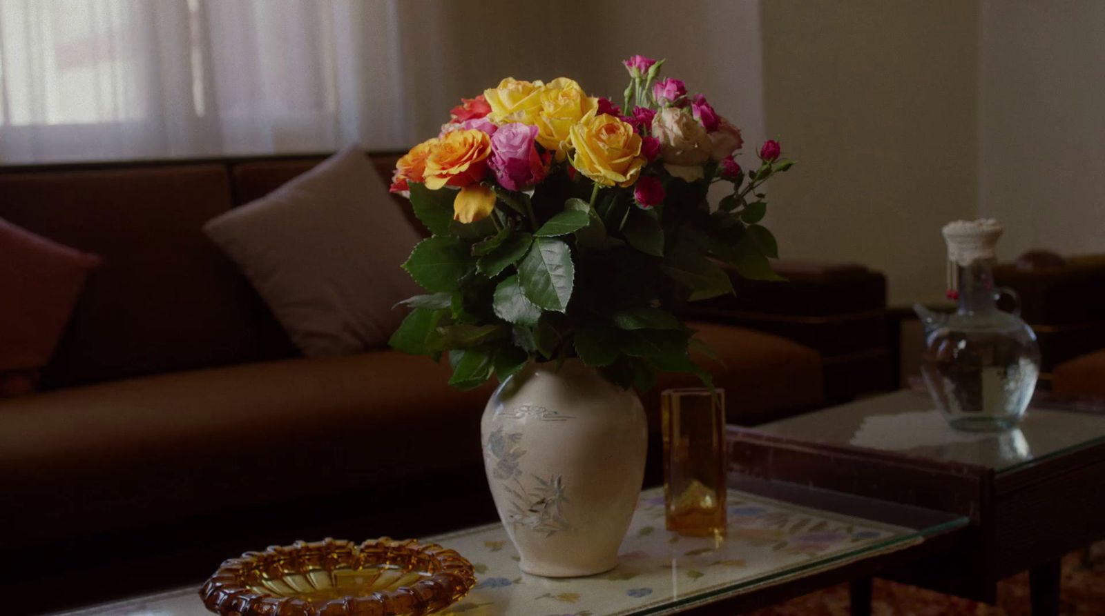 a vase of flowers on a table in a living room