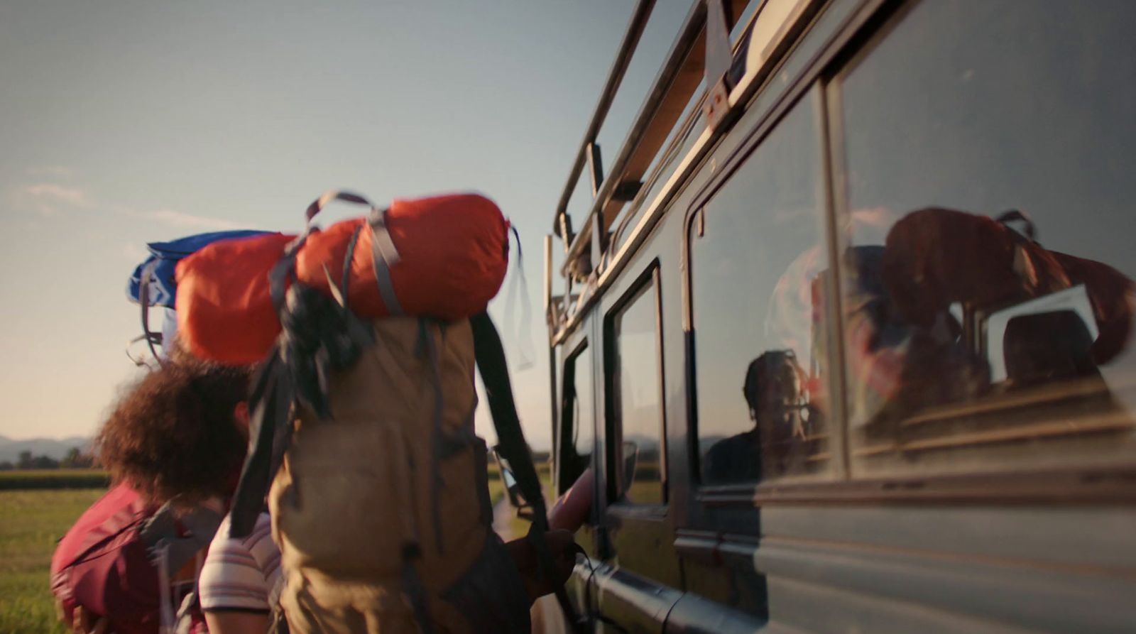 a group of people getting on a bus