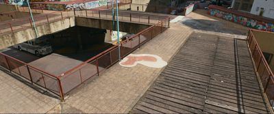 an overhead view of a skateboard park with graffiti on the walls