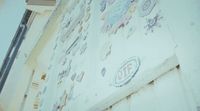 a wall with a lot of stickers on it