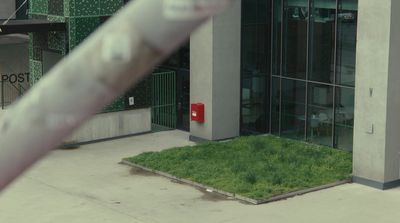 a building with a grassy area in front of it