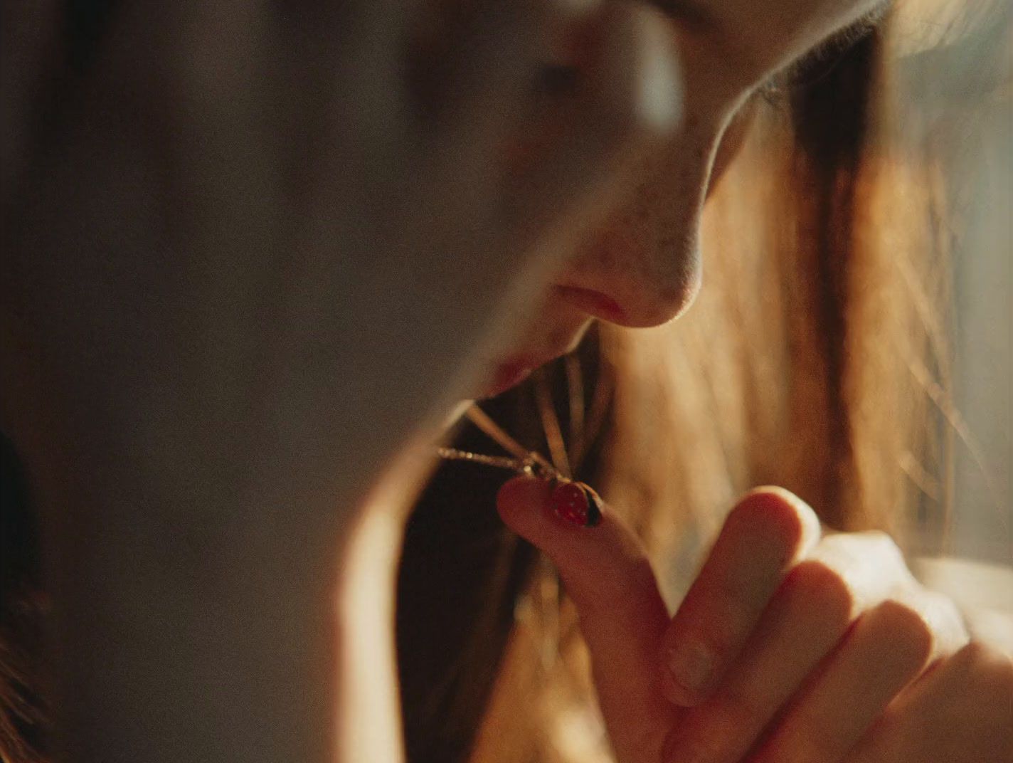 a close up of a person holding something in their hand