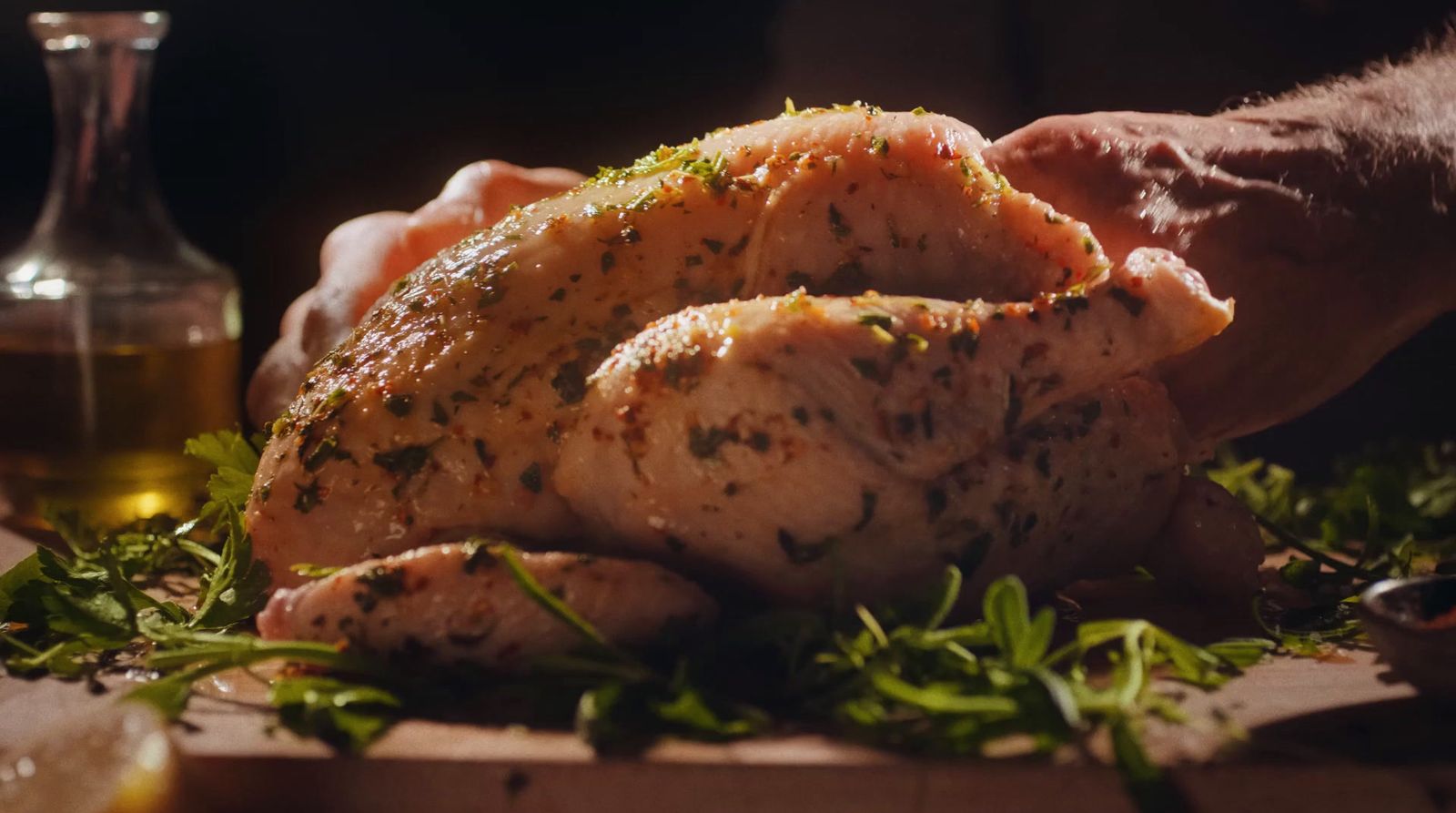 a close up of a person holding a piece of meat