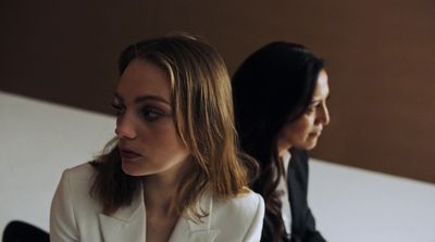 a couple of women sitting next to each other