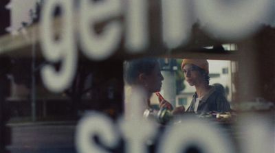 a reflection of two people in a mirror