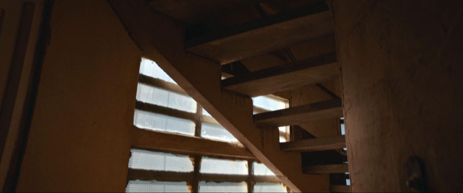 a stair case in a house with a window