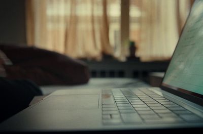 a laptop computer sitting on top of a table