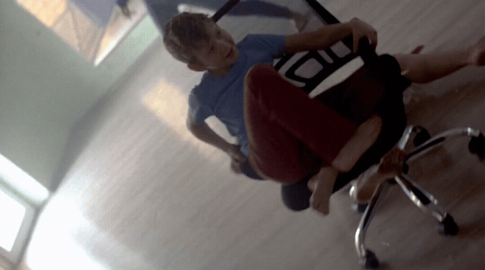 a man sitting on a chair in a room