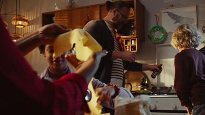 a group of people in a kitchen preparing food