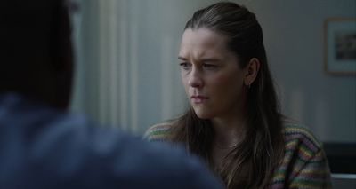 a woman with a concerned look on her face