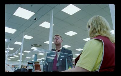 a man standing next to a woman in a store