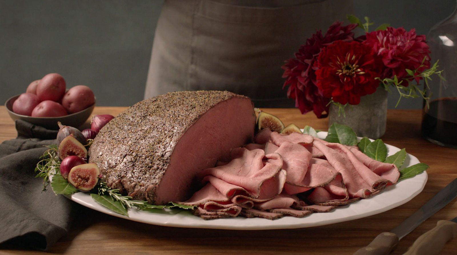 a platter of meat and vegetables on a table