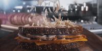 a close up of a sandwich on a cutting board